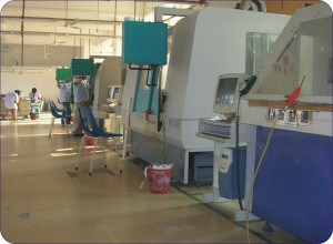 A factory in China today, with CNC (computer controlled) lathes. 