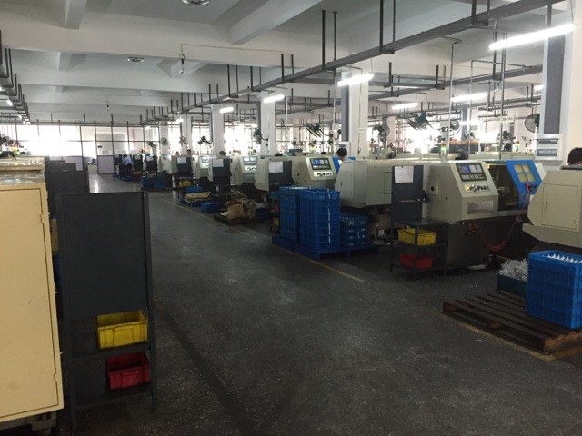 Rows of CNC lathes at a machine shop.