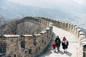 Mother and two children walking along the Great Wall of China